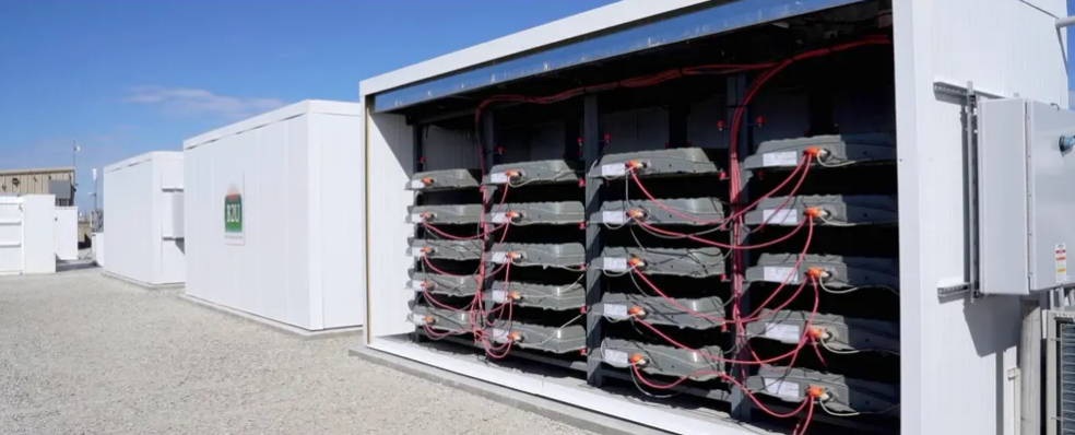 Sunset over industrial landscape representing the future of energy