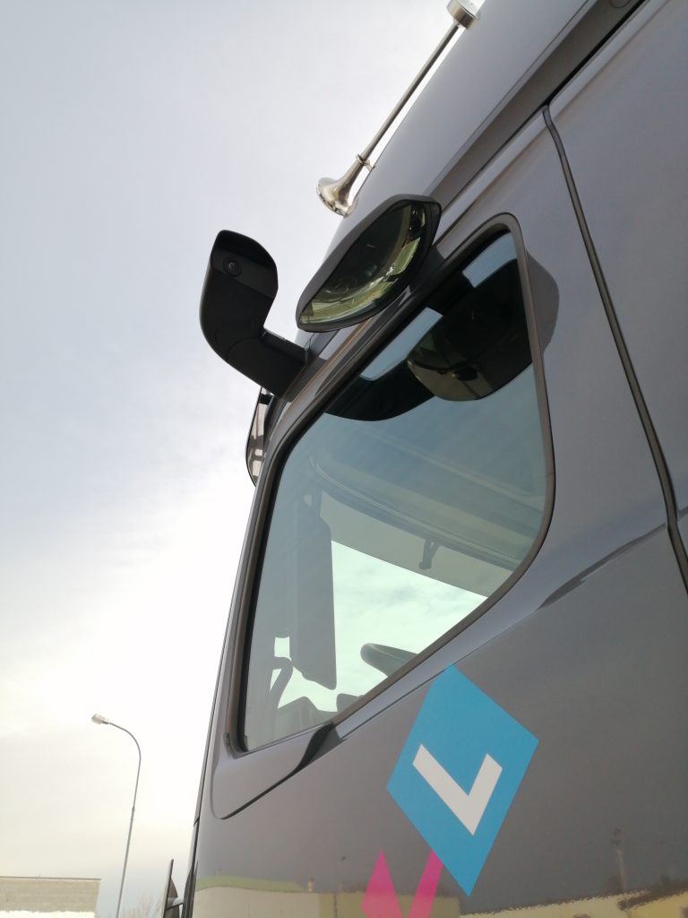 Side camera of a Mercedes-Benz Actros 5 MirrorCam digital mirror system mounted on the L-shaped bracket