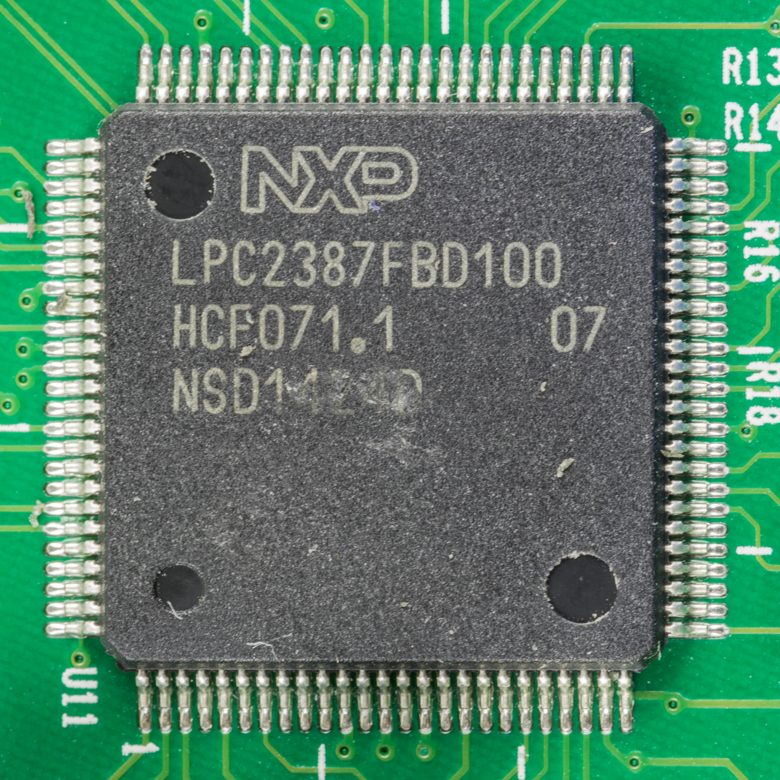 An Arm microcontroller in an LQFP-100 package on a circuit board