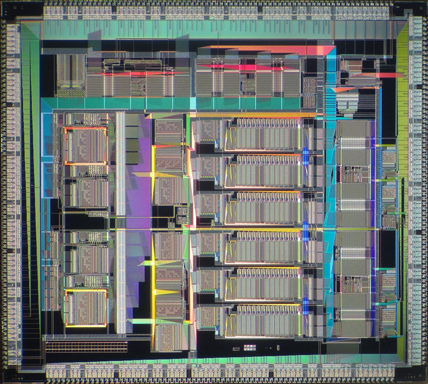 A die photograph of a digital signal processor, showing regular memory arrays and the multiply-accumulate data path that does the signal math.