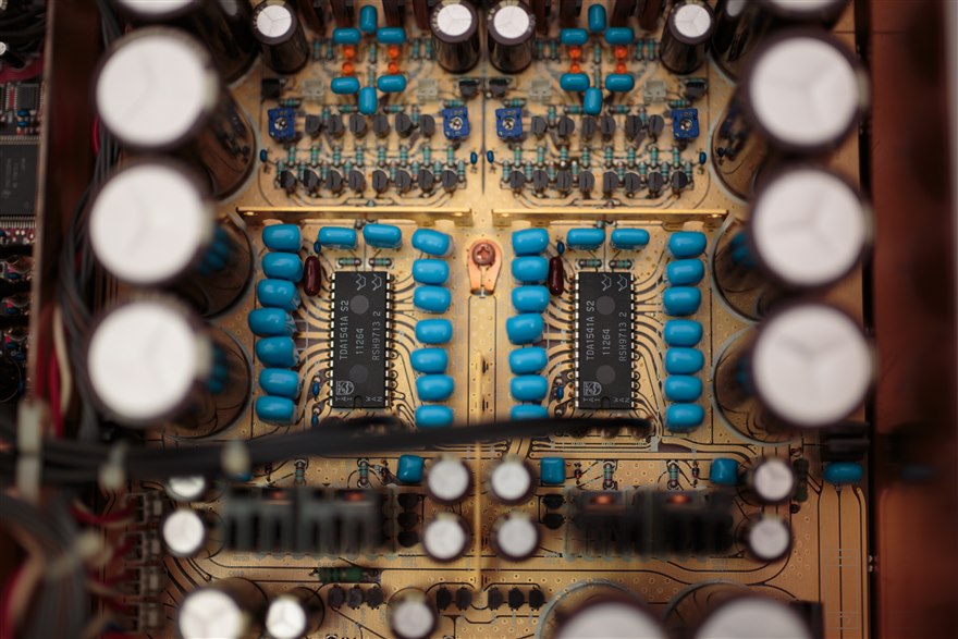 A high-end converter board with dual TDA1541A chips surrounded by decoupling capacitors and trim potentiometers.