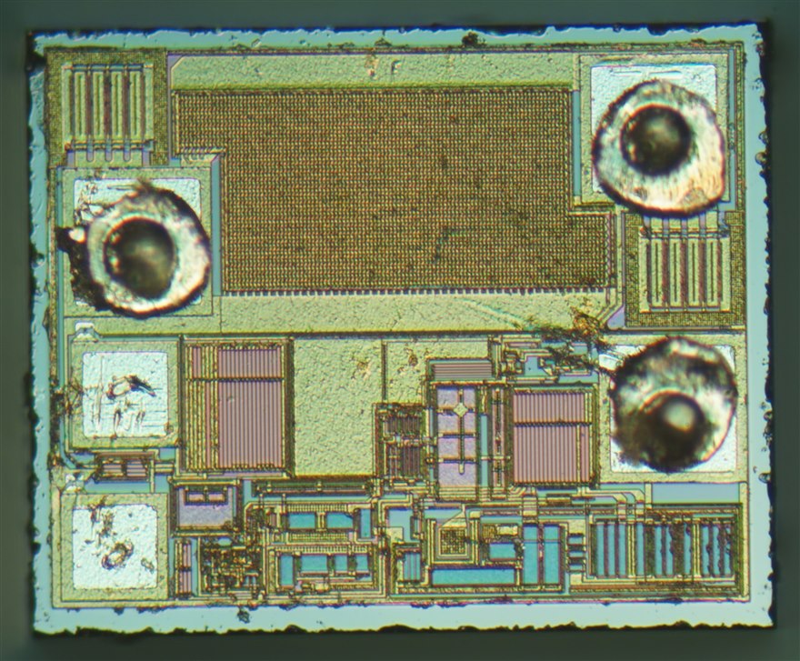 The die of an XC6206 LDO regulator under a microscope, the large rectangular block being the series pass transistor.