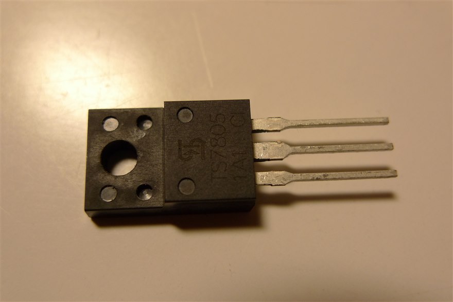 A TS7805 linear voltage regulator in a TO-220 package with a metal heatsink tab and three leads.