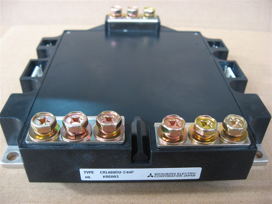A Mitsubishi CM1400DU-24NF IGBT power module, a black package with bolt-down power terminals.