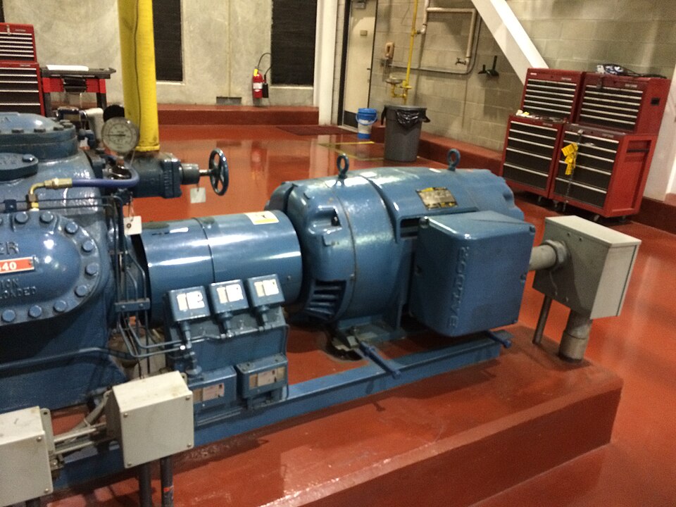 A real motor-driven reciprocating compressor in an engine room