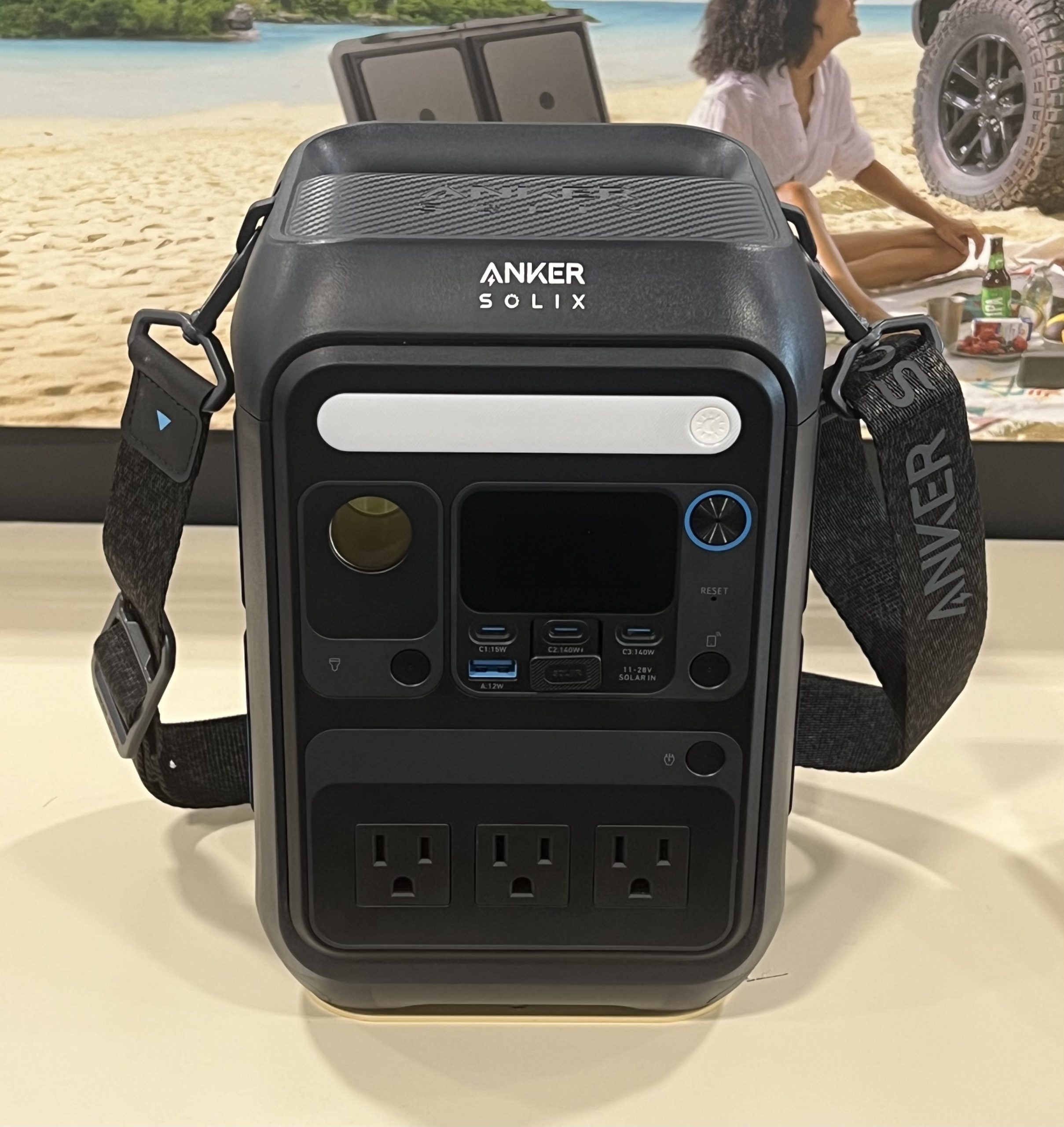 An Anker SOLIX C300X portable power station with a front screen, USB-C ports and three AC sockets