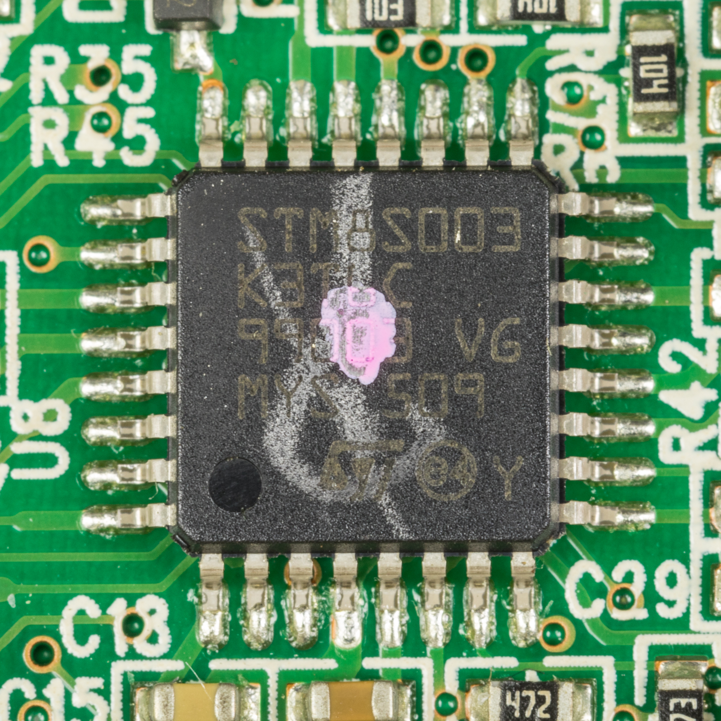 An STM8S003 8-bit microcontroller on a product board