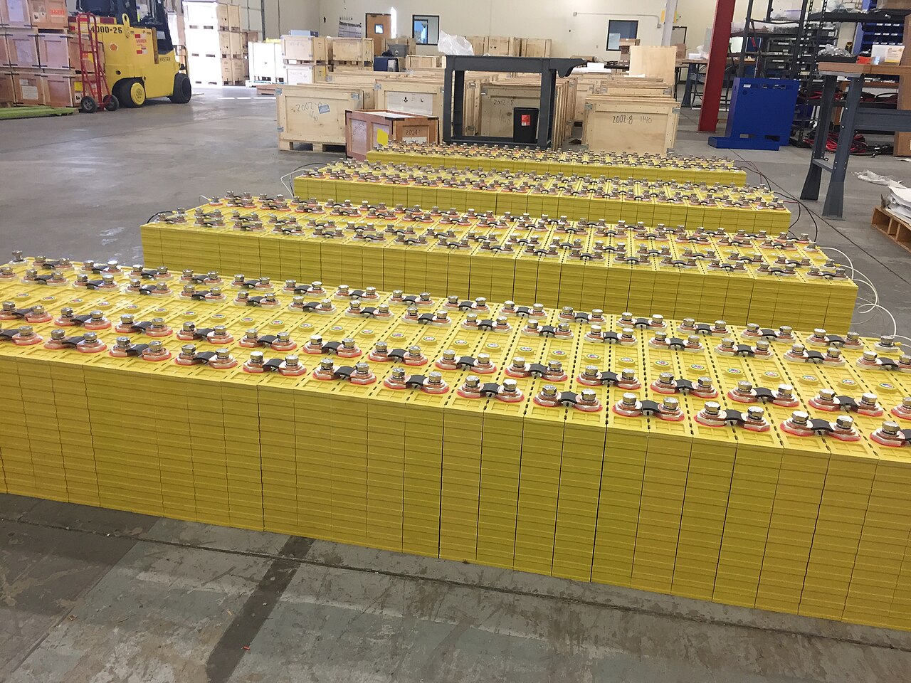 Rows of prismatic LiFePO4 battery cells in a facility
