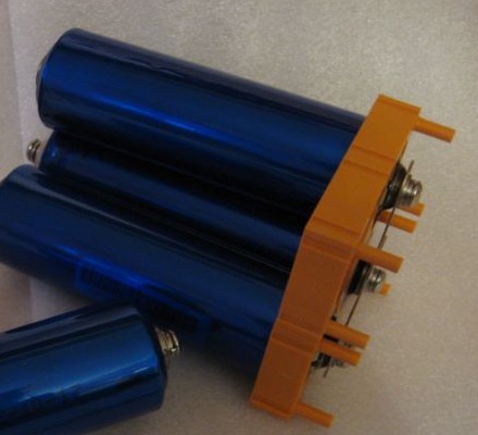 Cylindrical LiFePO4 cell beside a ruler for scale