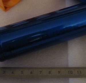 Cylindrical LiFePO4 cell beside a ruler