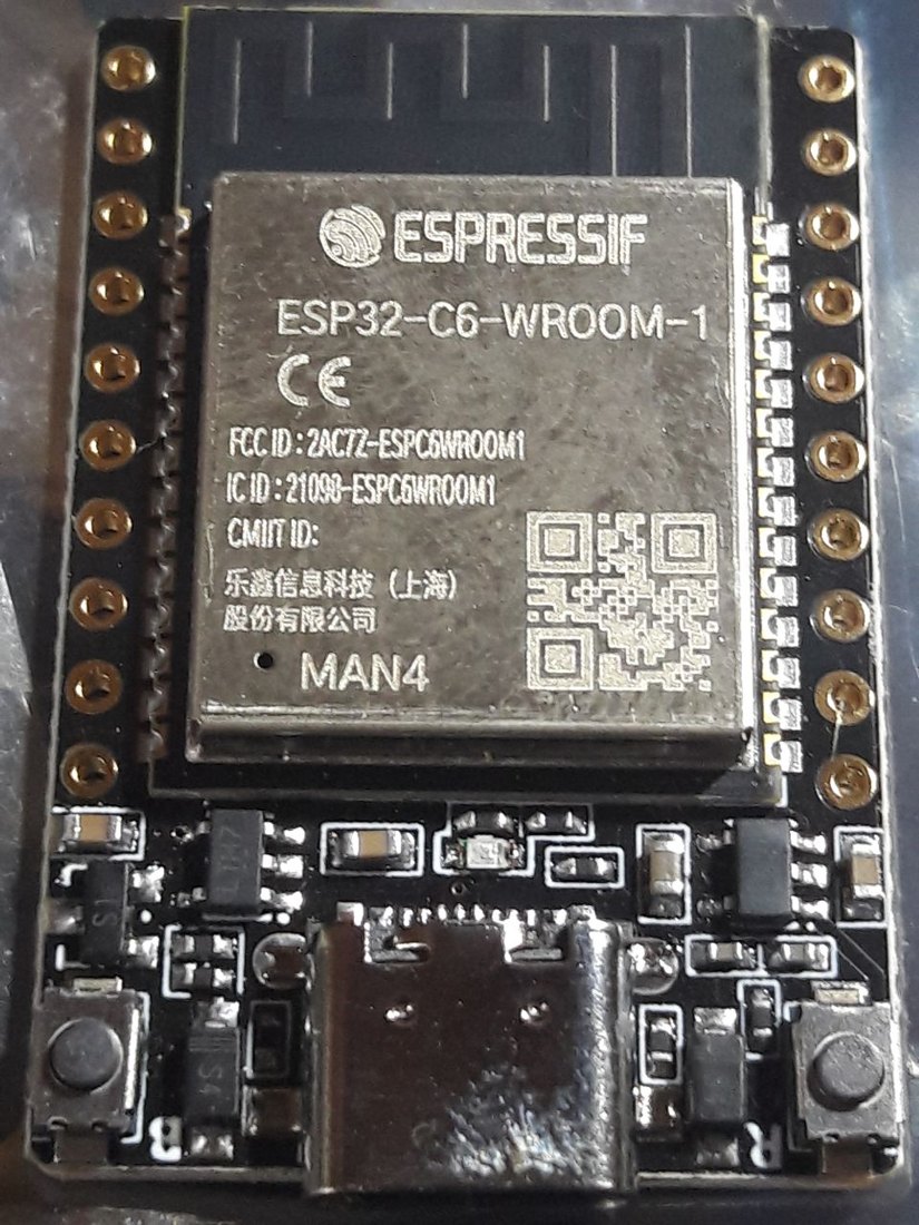 An official Espressif ESP32-C6-WROOM-1 development board with the Espressif module, header pins, and a USB-C connector