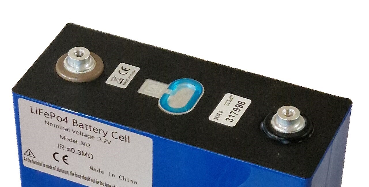 Terminals, fill port seal and vent area on top of a prismatic LiFePO4 cell