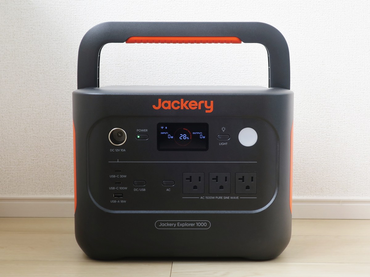 Front face of a Jackery Explorer 1000 portable power station, its display showing an input line at 0 W and output sockets below