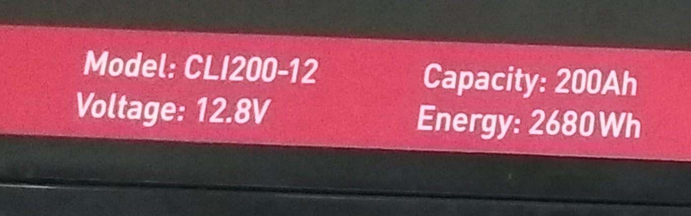 A battery nameplate reading model, voltage, capacity in amp-hours and energy in watt-hours